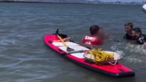 Teen swimming in rising California waters gets stuck in mud in edge of your seat video