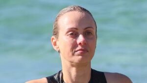 Sylvia Jeffreys shows off her fit figure in a sporty one-piece as she braves the cold for an early morning swim at Bronte Beach